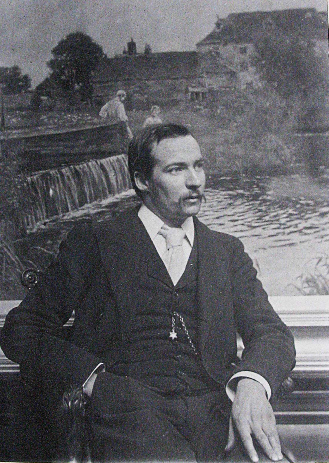 Young man in front of a painting by Yeend King